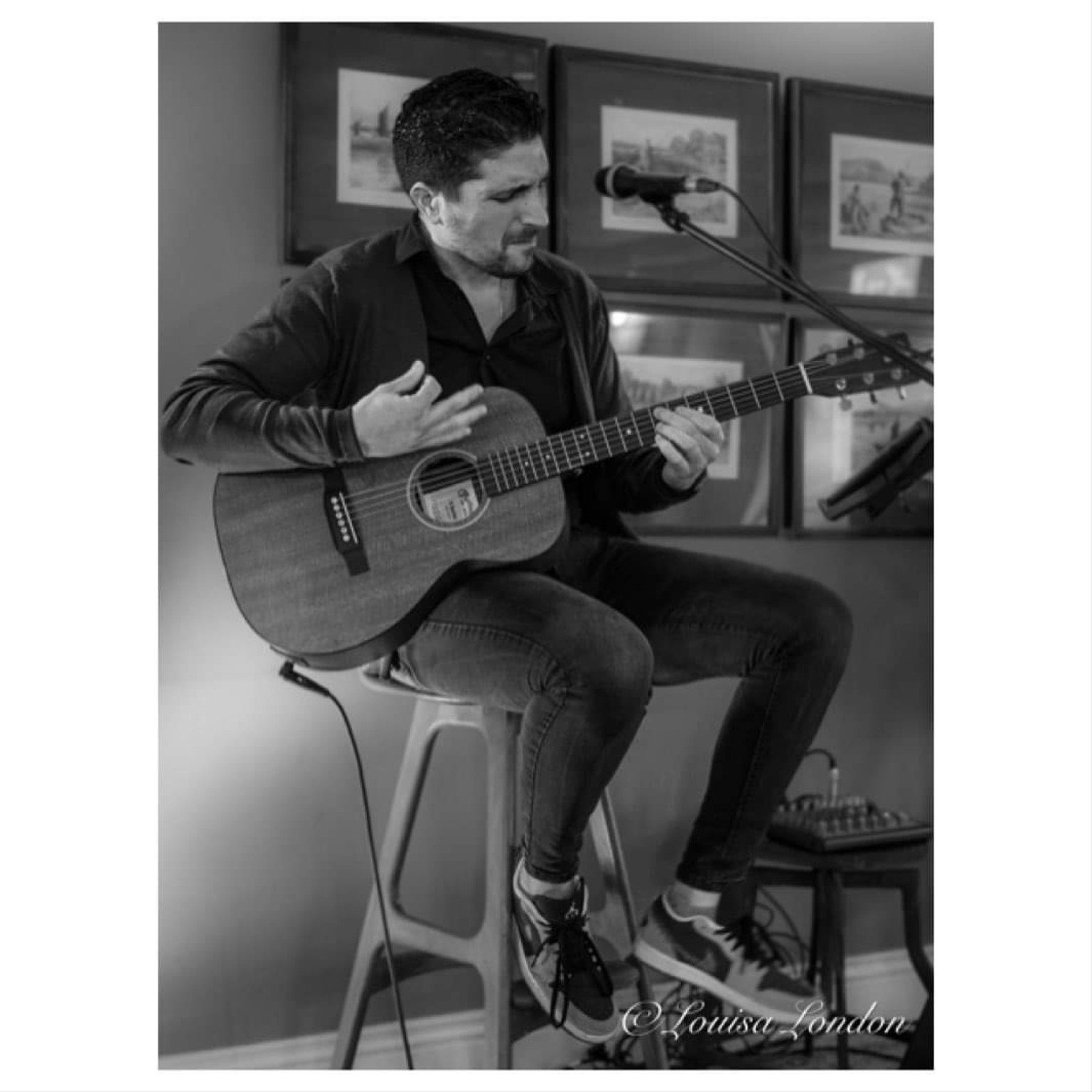 Ross Grillo performing acoustic guitar